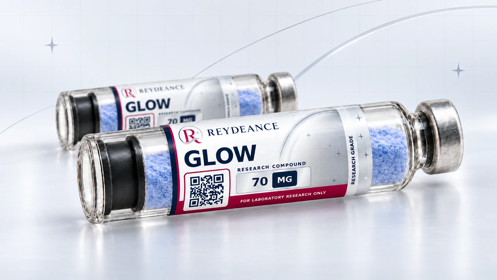 Two Reydeance GLOW 70 mg pen cartridges lying on a pale studio surface.